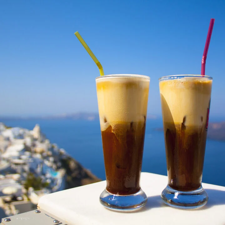 Two freddo coffees with a sea view